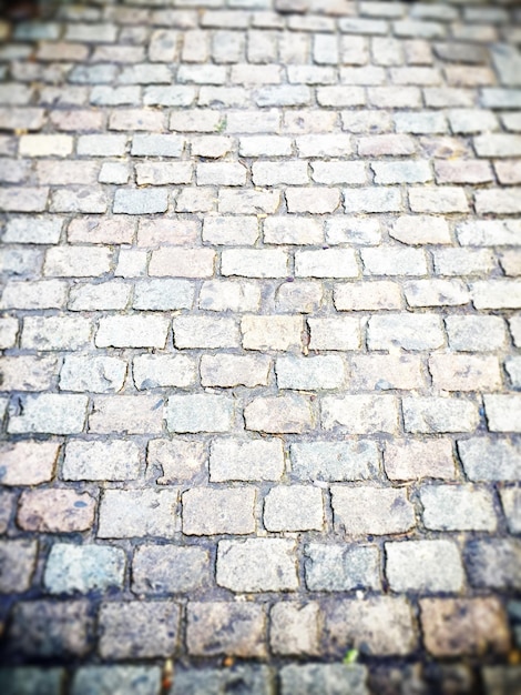 Фото Полный кадр улицы с мощеным камнем