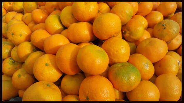 Full frame shot of orange fruit in market stall