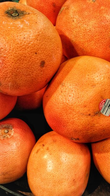 Full frame shot of orange fruits in market