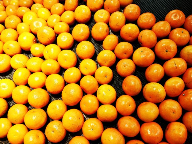 Full frame shot of oranges in market