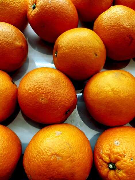 Photo full frame shot of oranges in market