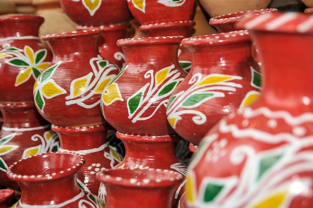 full frame shot of painted earthenware for sale in market