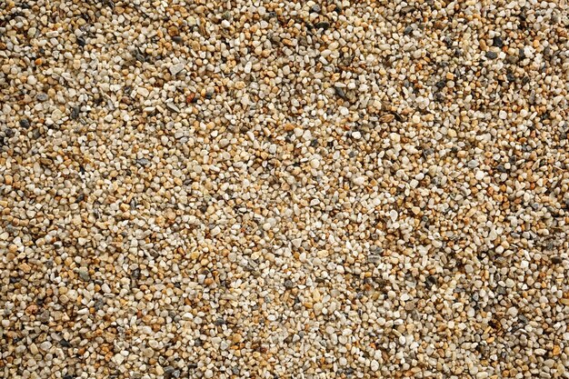 Full frame shot of pebbles on sand