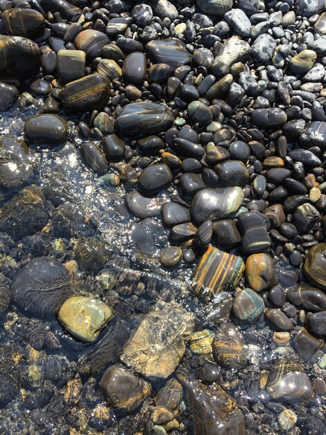 Photo full frame shot of pebbles on shore