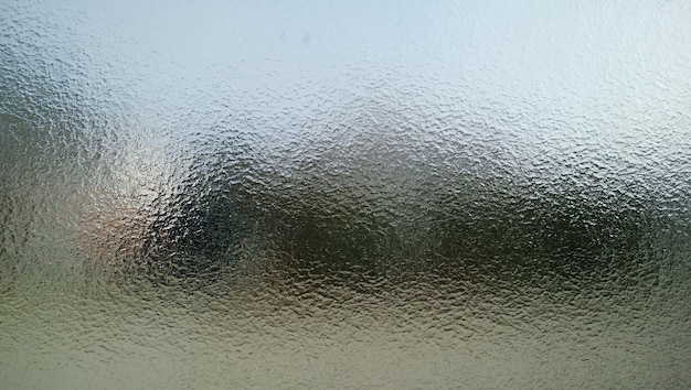 Foto fotografia completa delle gocce di pioggia sulla finestra di vetro