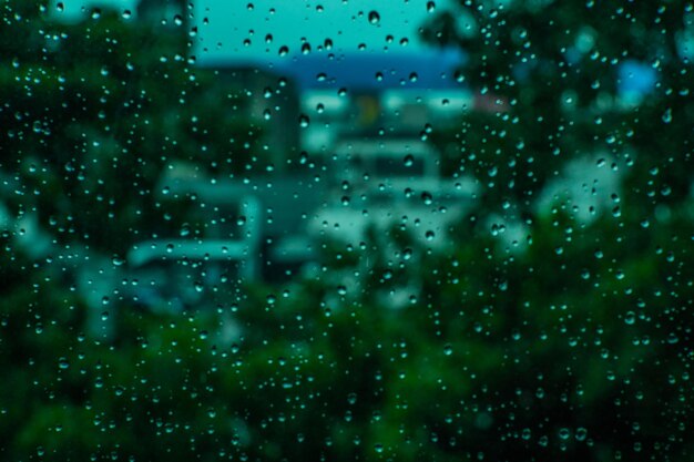 Full frame shot of raindrops on glass window