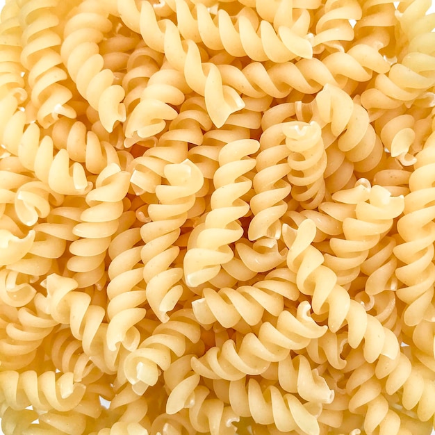 Photo full frame shot of raw pasta against white background