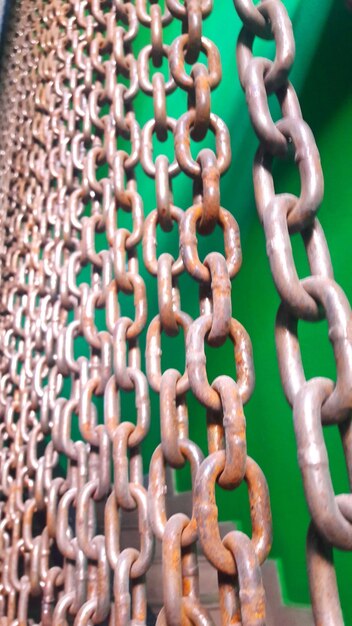 Photo full frame shot of rusty metallic chains