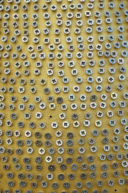 Full frame shot of screw art on structure