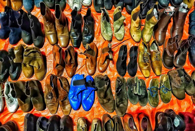 Photo full frame shot of shoes hanging at market stall