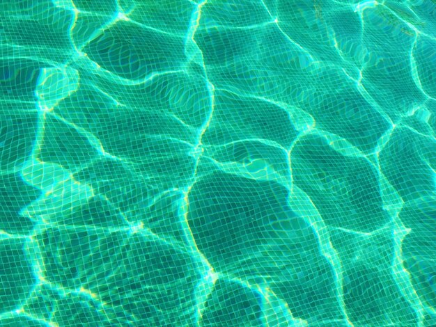 Full frame shot of swimming pool with sunlight