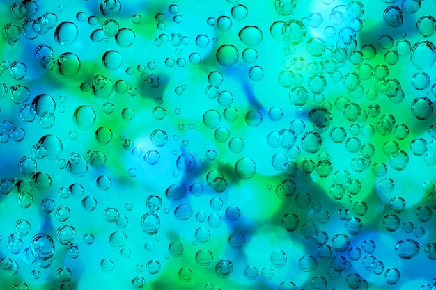 Photo full frame shot of turquoise bubbles on glass