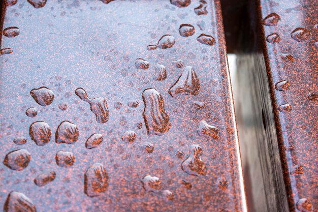 Full frame shot of water drops on rusty metal