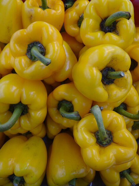 Full frame shot of yellow bell peppers for sale in market