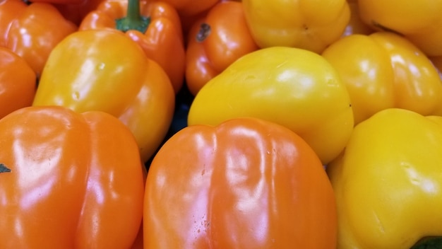 Full frame shot of yellow bell peppers for sale in market