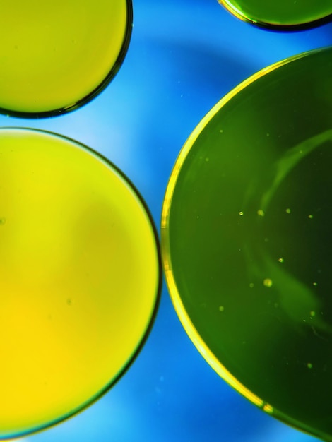 Full frame shot of yellow and blue water on table