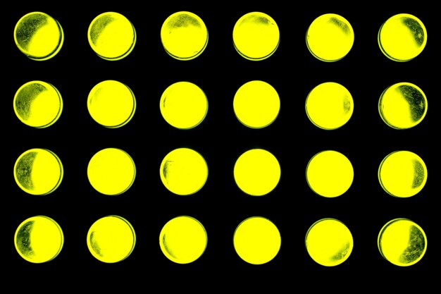 Photo full frame shot of yellow illuminated led lights against black background