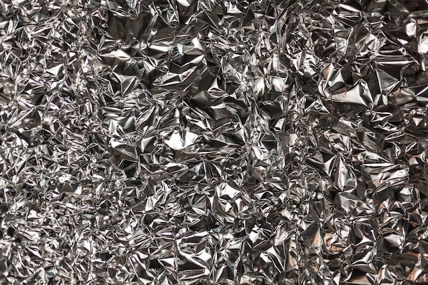 Full frame take of a sheeT of crumpled silver aluminum foil
