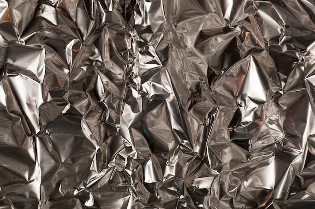 Full frame take of a sheeT of crumpled silver aluminum foil