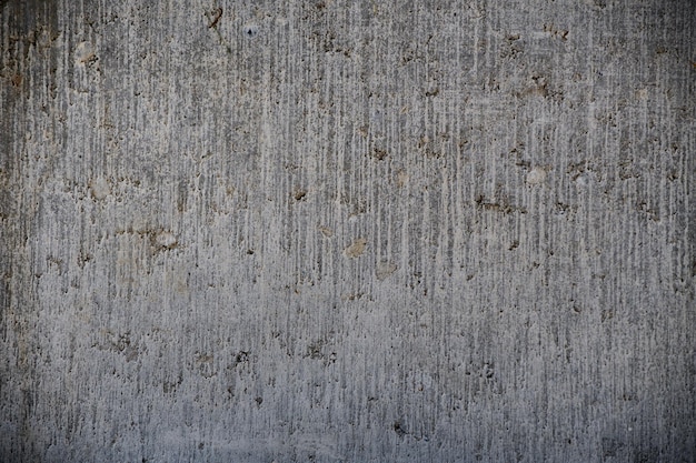 Full Frame texture of an old and weathered dark gray concrete wall for your industrial project background high resolution image