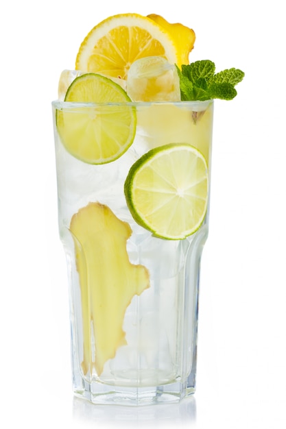 full glass of fresh birch juice with lemon, ginger and mint leaves