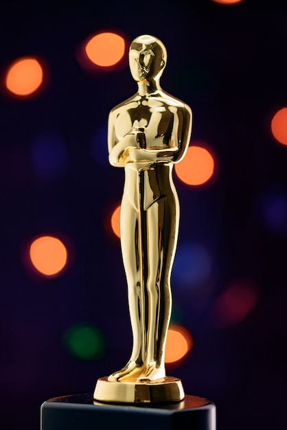 Full Golden Statuette on Defocused Lights