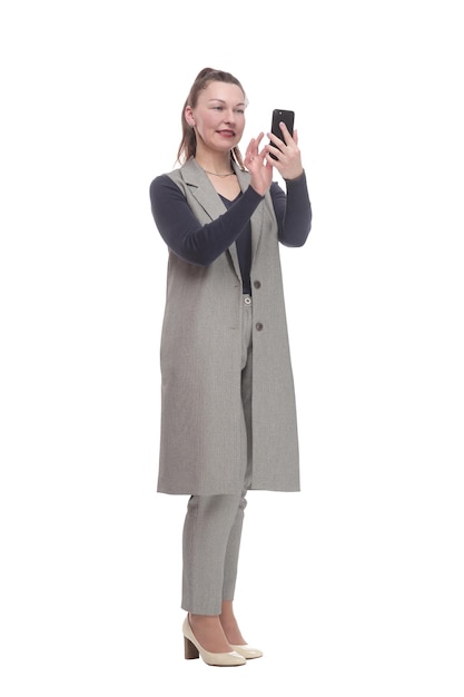 In full growth attractive woman with a smartphone