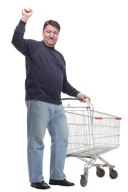 In full growth. casual mature man with shopping cart .