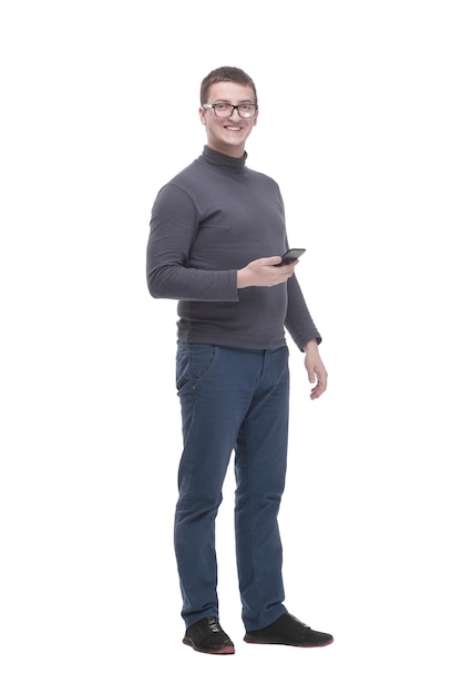 Photo in full growth casual young man with a smartphone