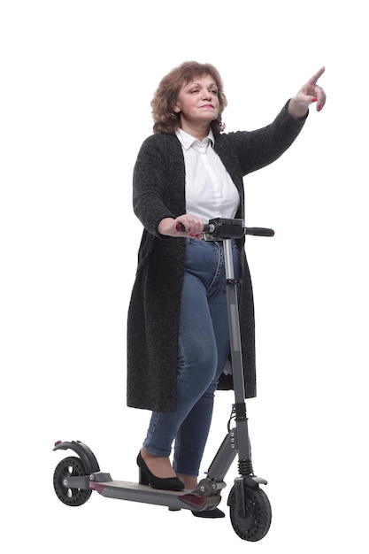 In full growth confident adult woman with an electric scooter