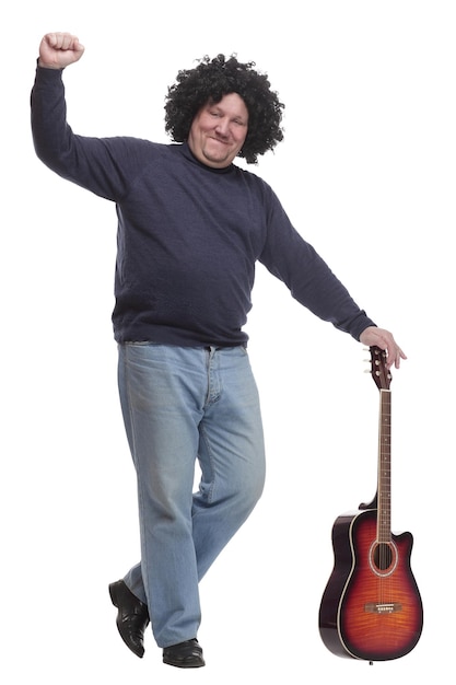 In full growth curlyhaired mature man with a guitar