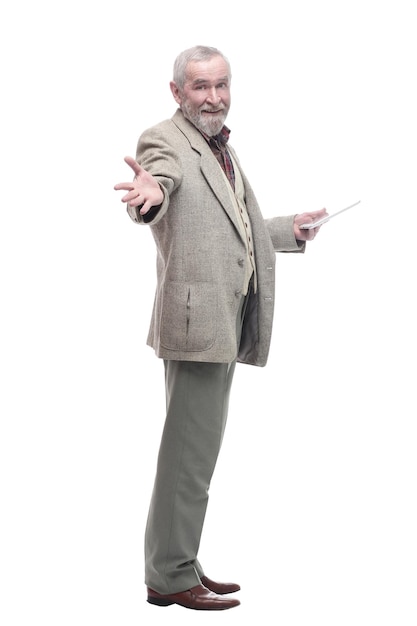 in full growth. elderly business man with a digital tablet. isolated on a white background.