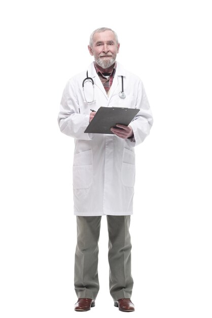 In full growth. elderly competent doctor with clipboard. isolated on a white background.