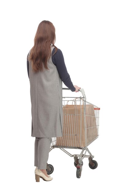 In full growth elegant woman with a shopping cart