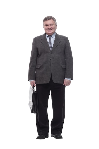 In full growth.Executive business man with a leather briefcase . isolated on a white background.