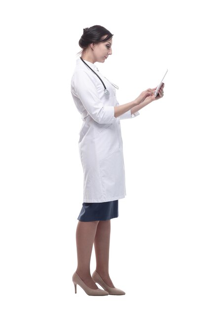 In full growth female doctor with a digital tablet