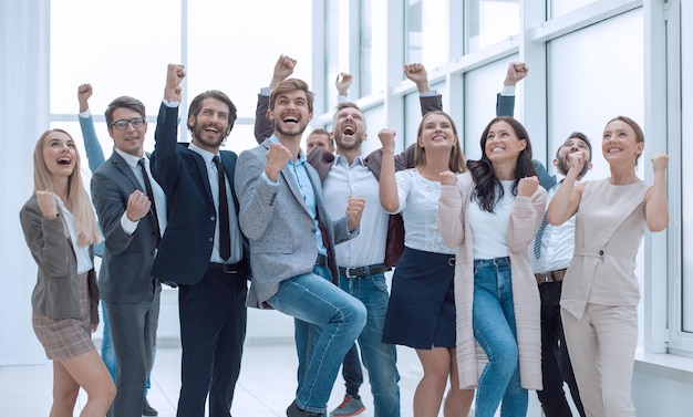 Photo in full growth a group of happy young business people