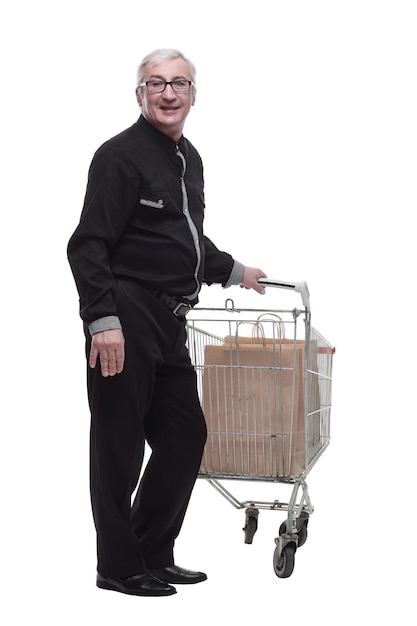 In full growth happy old man with a shopping cart