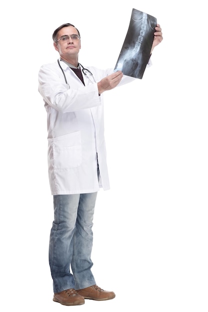 Photo in full growth qualified doctor looking at an xray