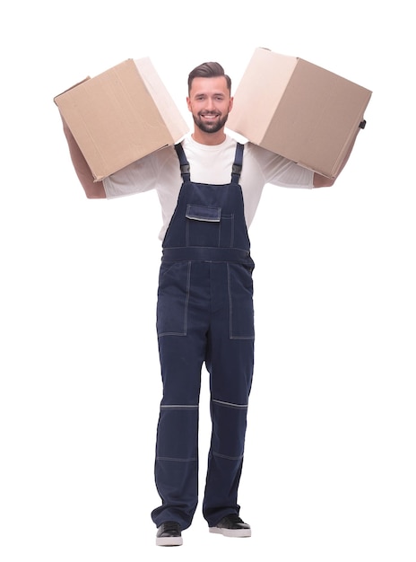 In full growth a smiling man with cardboard boxes on his shoulders