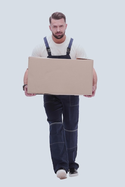 Photo in full growth a smiling man with cardboard boxes on his shoulders