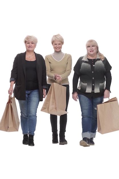 In full growth three happy women with shopping bags