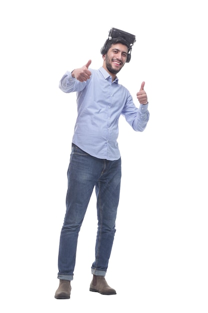 In full growth young man in VR glasses showing thumbs up