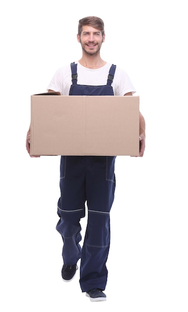 In full growtha man carries a large cardboard boxisolated on white background