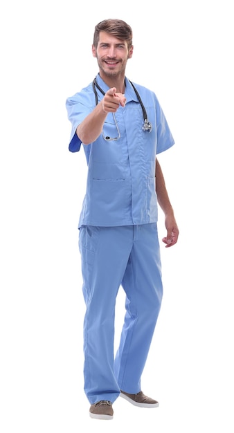 In full growtha medical doctor with a stethoscope pointing at youisolated on white background