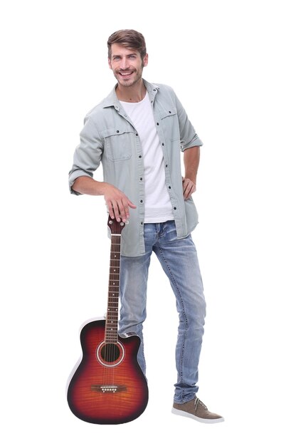 In full growtha young man with a guitarisolated on white background