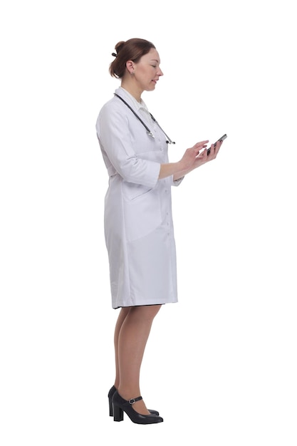 in full growthfemale doctor with a smartphone isolated on a white background