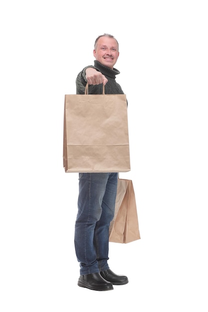 Full isolated studio picture from a man with shopping bags