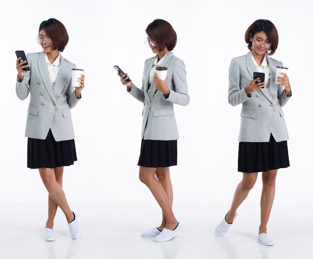 Full length 20s young Asian Woman teacher student lawyer wear blazer skirt looking at work