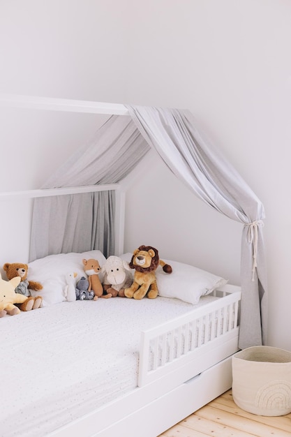 Photo full length of baby crib with stuffed animals on it